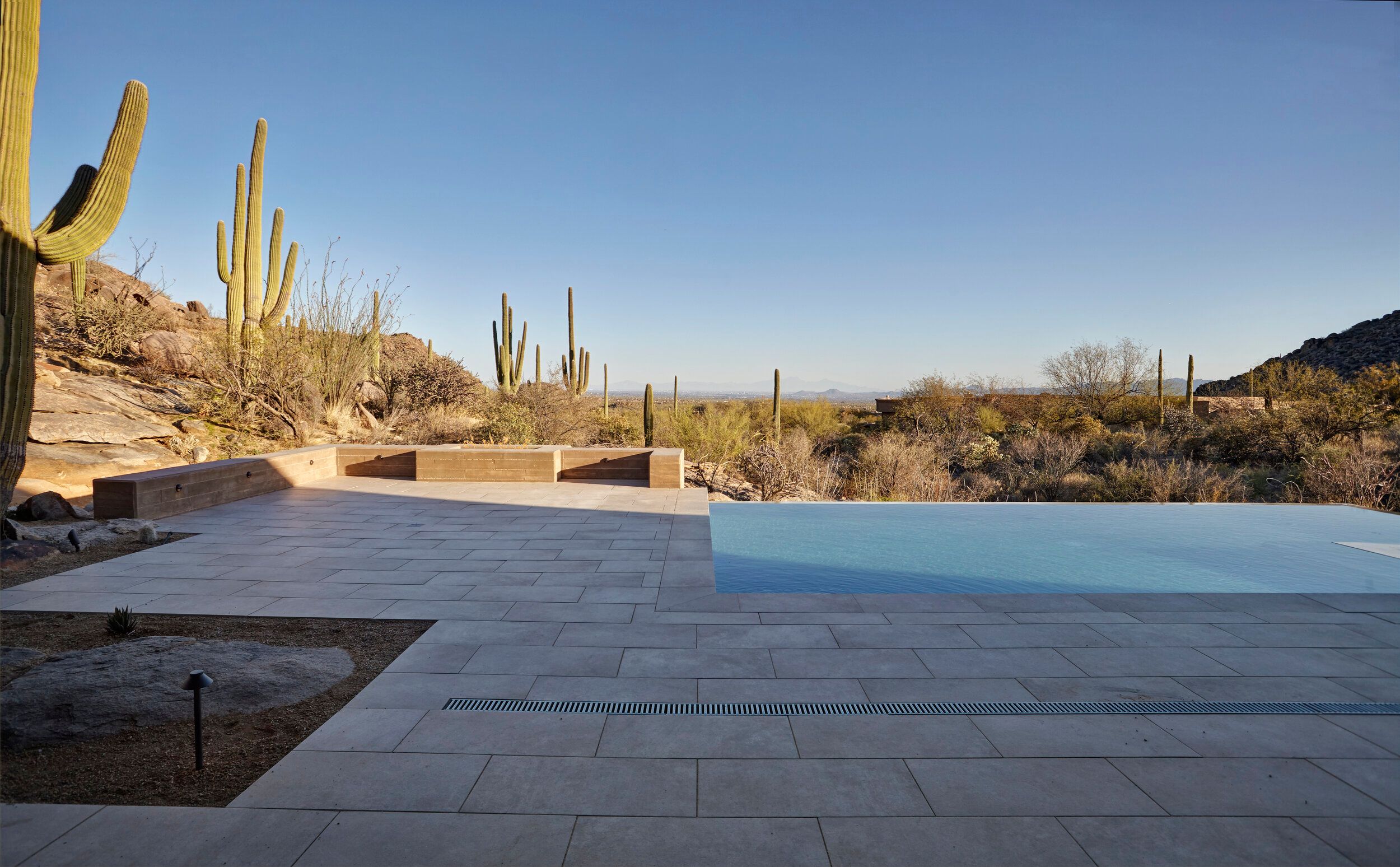 Negative-edge pool looking out over the desert toward distant peaks
