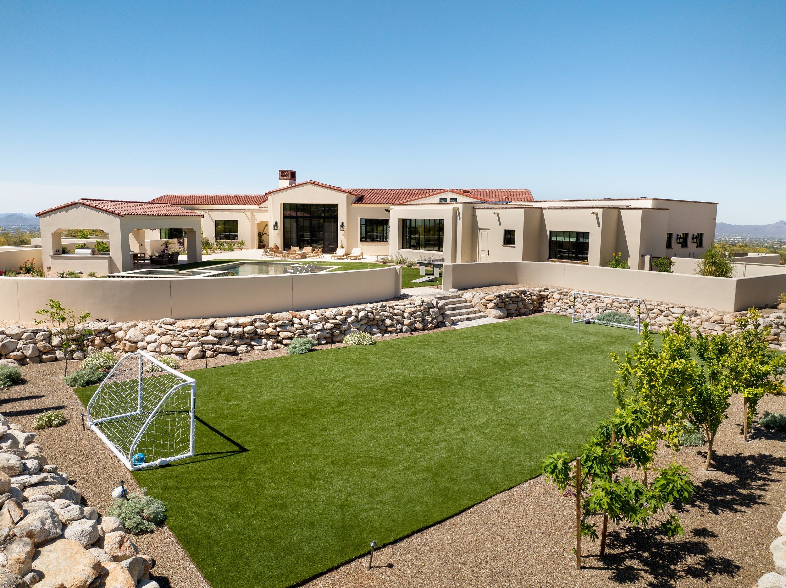 Aerial of the lawn and sports goal beside the pool terrace